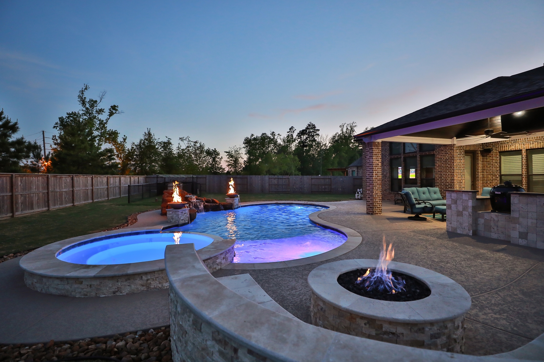 Poolside Fire Pit - Freeform Pool with Rock Waterfall, Custom Lighting and Fire Bowls